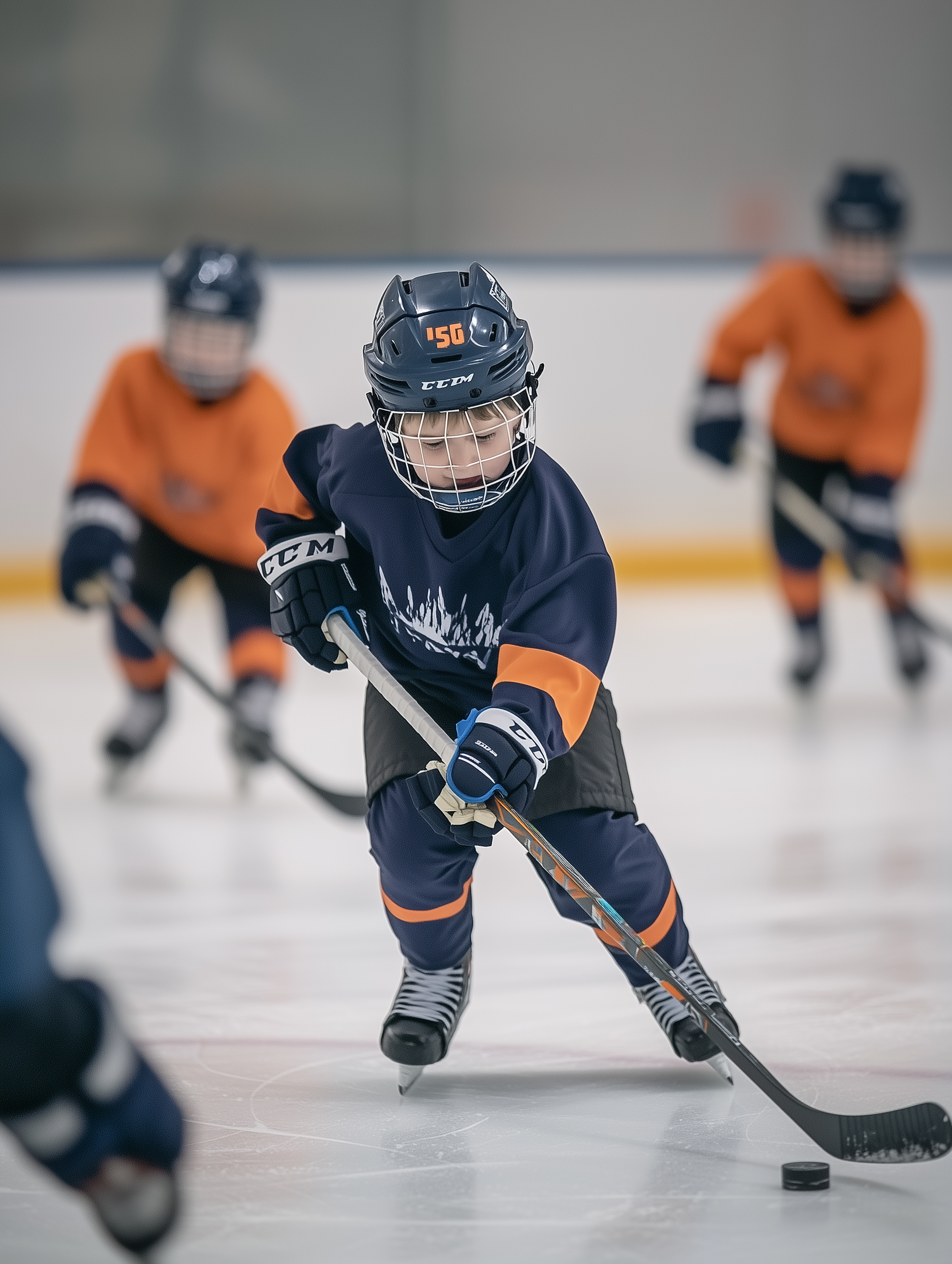 A young boy playing ice hockey.